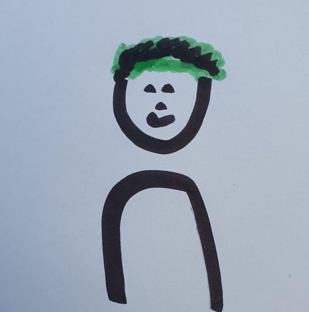 sehr grob gezeichnete Flipchart-Zeichnung einer Person mit grün-schwarzen kurzen Haaren.